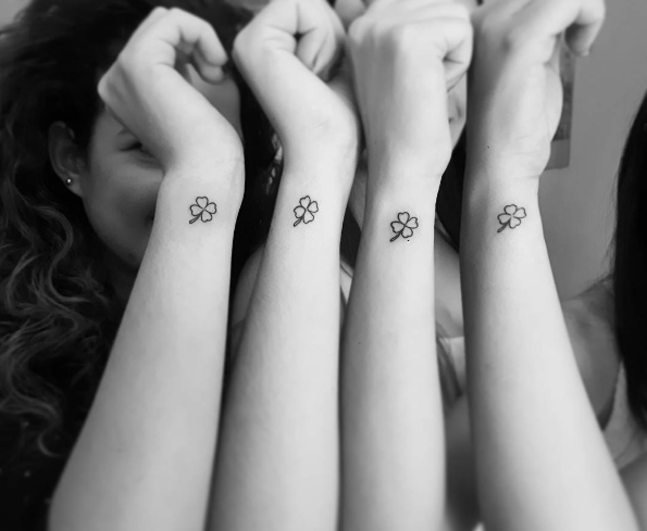 Matching small four leaf clover tattoos for best friends