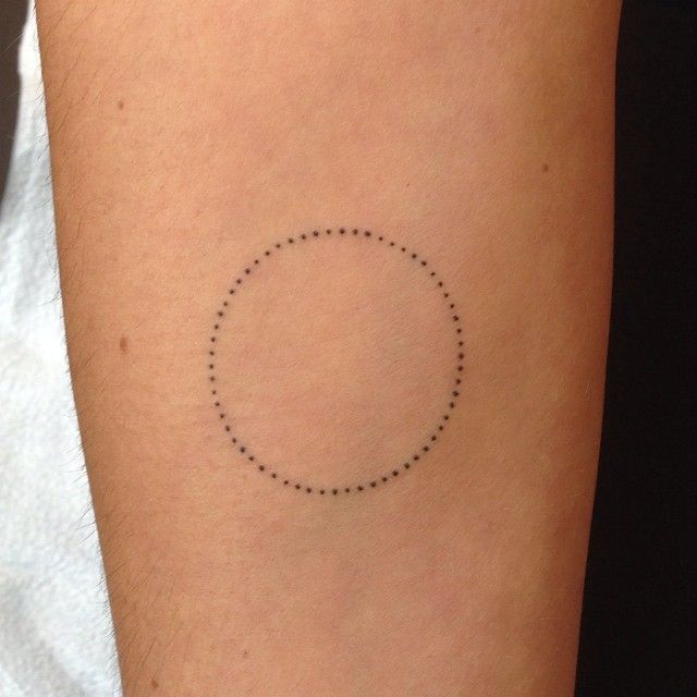 Minimal dotted circle tattoo