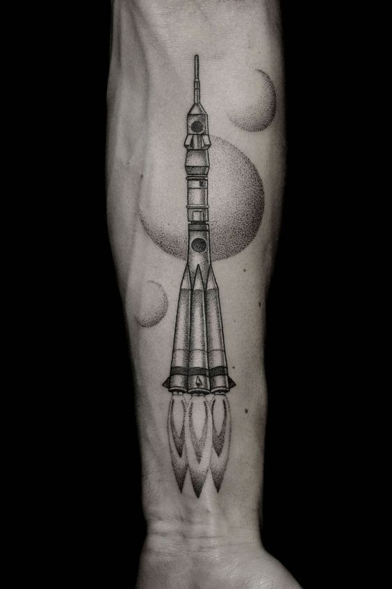 Rocket lift tattoo on the forearm