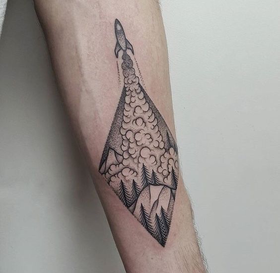 Rocket tattoo in the wilderness landscape