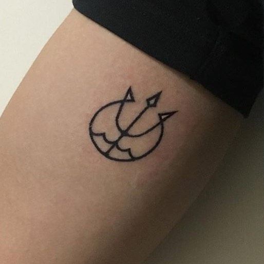 Small trident mark tattoo