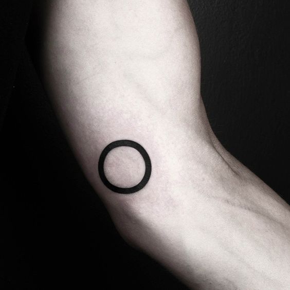 Thick outline circle tattoo on the arm