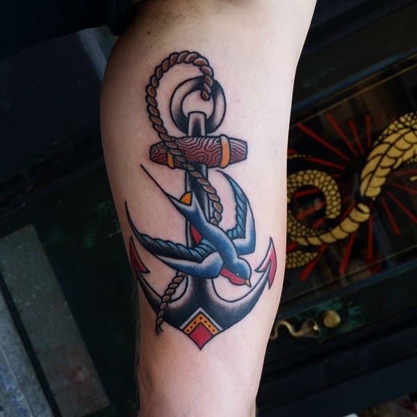 Traditional anchor and swallow tattoo