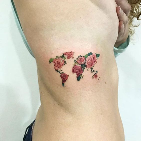 Floral world map tattoo on the rib cage