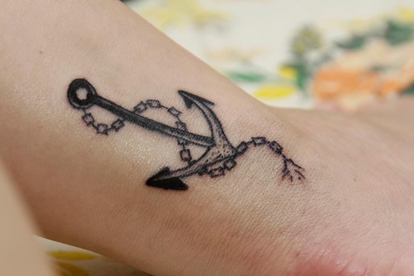 Little anchor and chain tattoo