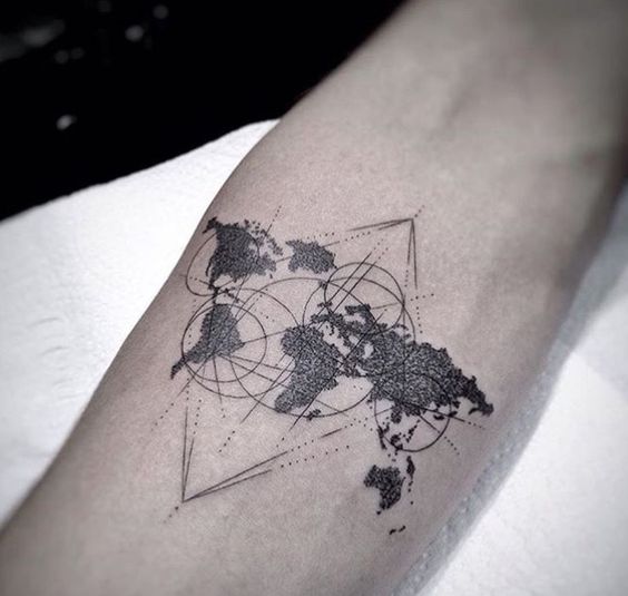 Minimal world map tattoo on the forearm