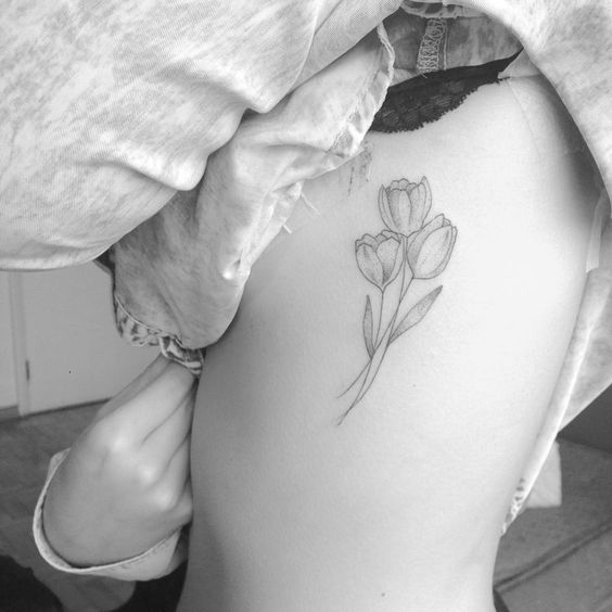 Minimalist tulips bouquet tattoo