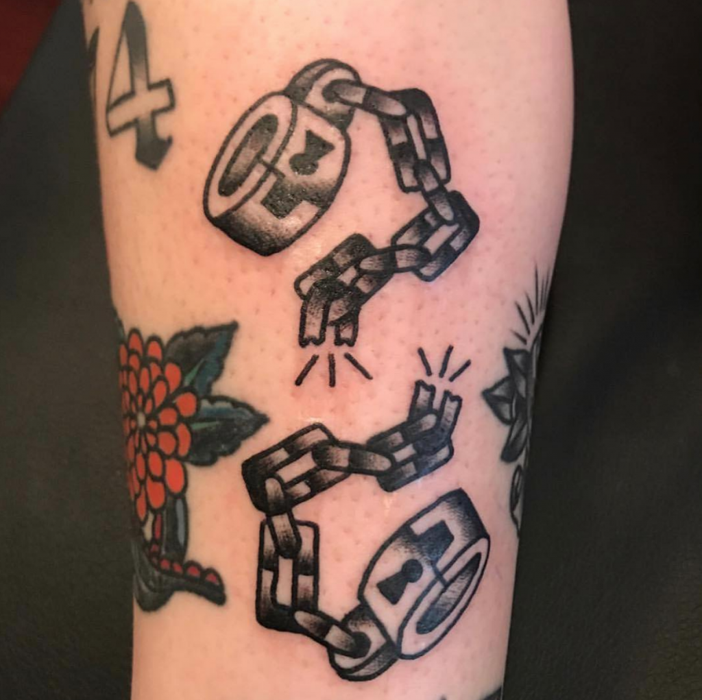 Traditional broken chains tattoo
