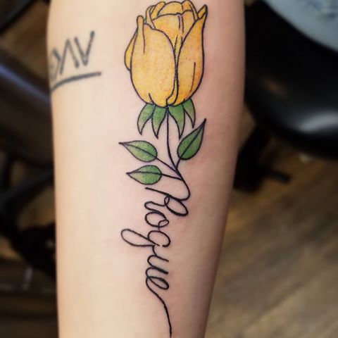 Traditional style yellow tulip tattoo