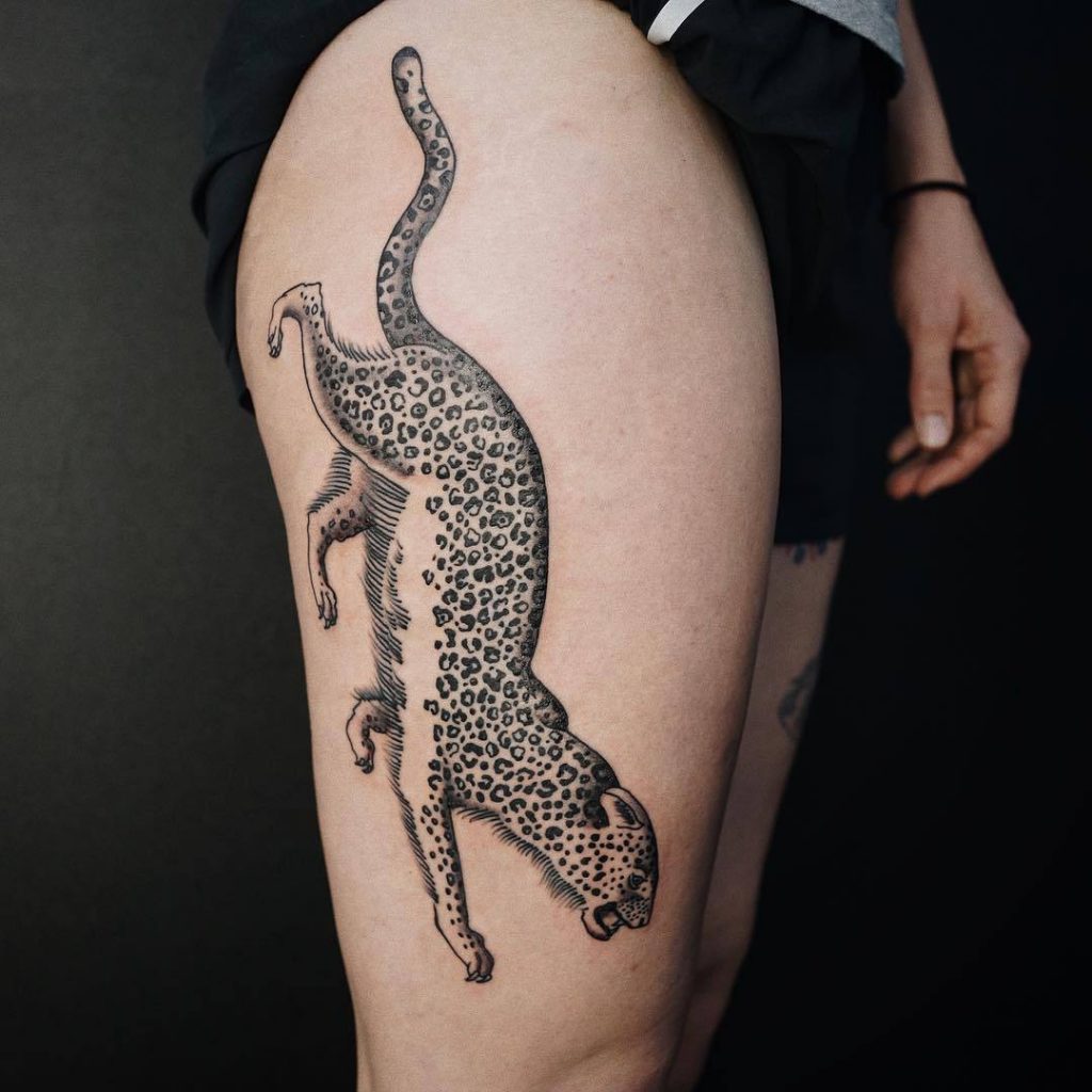 Gorgeous blackwork leopard tattoo on the thigh
