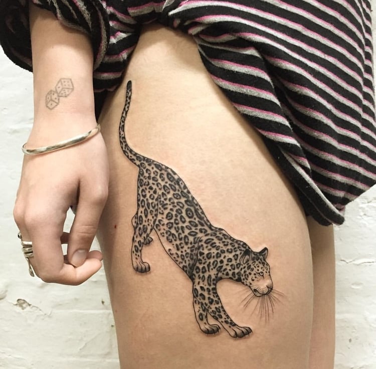 Leopard tattoo on the right thigh