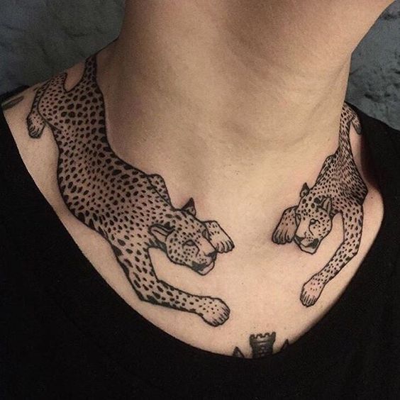Leopard tattoos on the clavicle bone