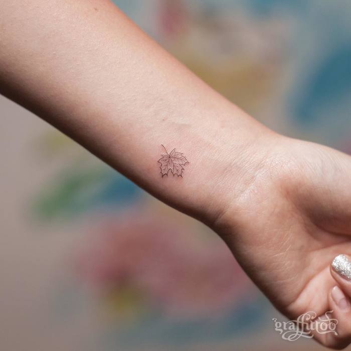 Little maple leaf tattoo on the inner wrist