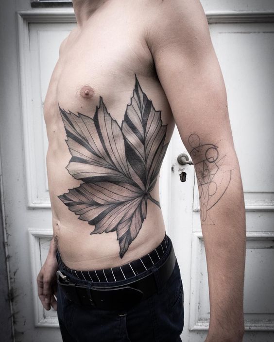 Maple leaf tattoo on the left side by karan sarin