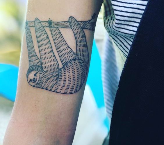 Adorable sloth tattoo on the right arm