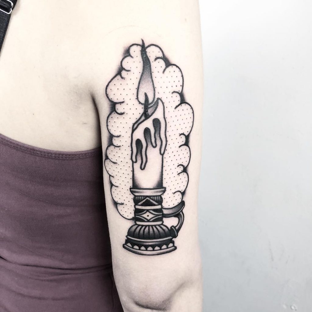 Black candle tattoo by Tobias Schneider