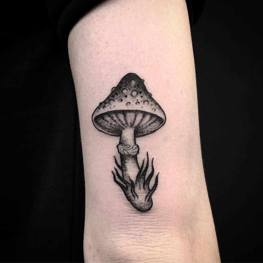 Black mushroom tattoo by Erin Mealing