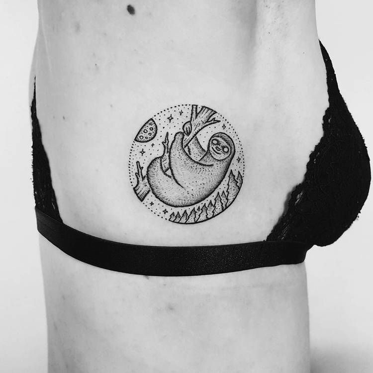 Circular tattoo of a sloth inked on the right rib cage