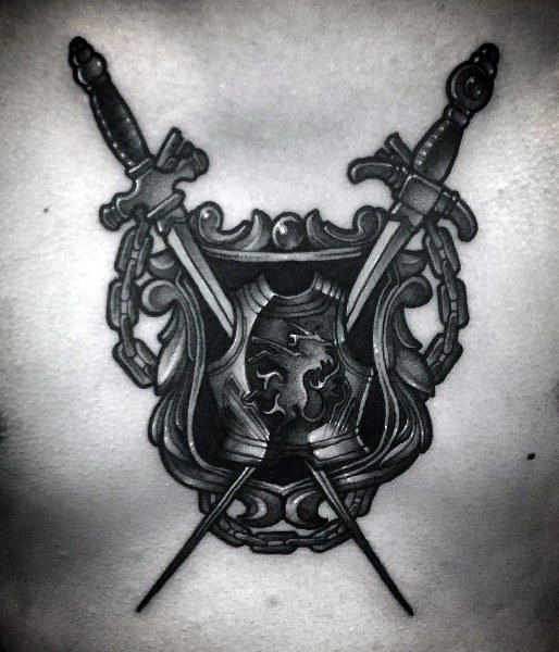 Crossed swords, armor and shield tattoo on the chest