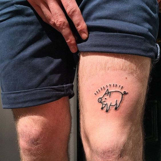 Cute pig tattoo on the left thigh
