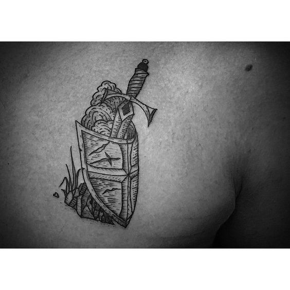Engraving sword and shield tattoo by jimmy memento