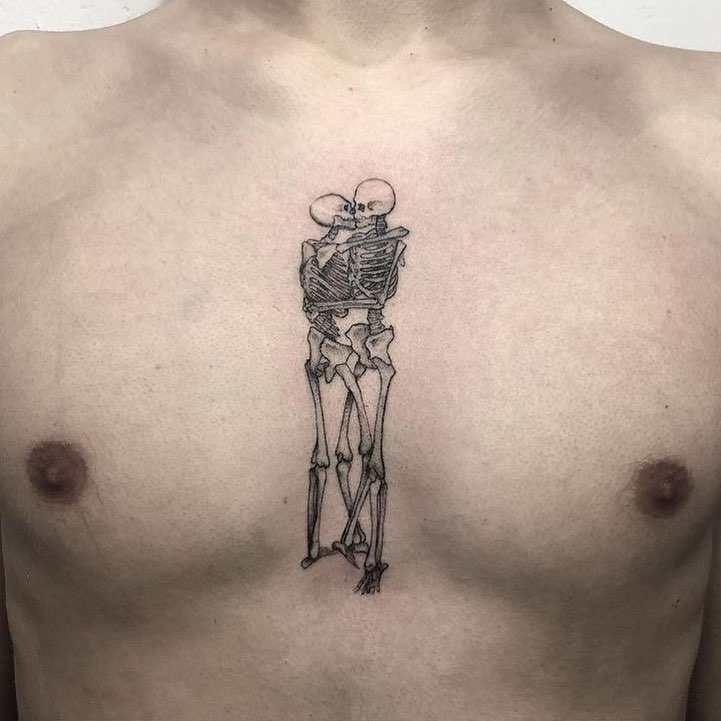 Kissing skeleton lovers tattooed on the chest by Heartbreak Kid