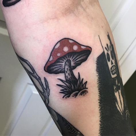 Little red and white mushroom tattoo