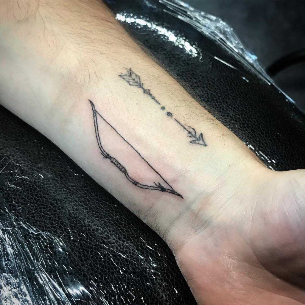 Matching bow and arrow on the left wrist by Keely Fx