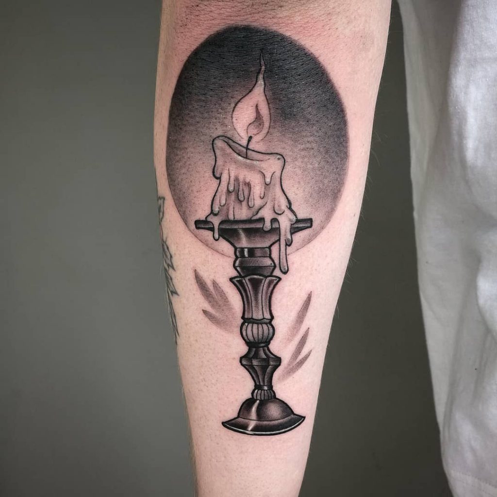 Melting candle on the candlestick tattoo