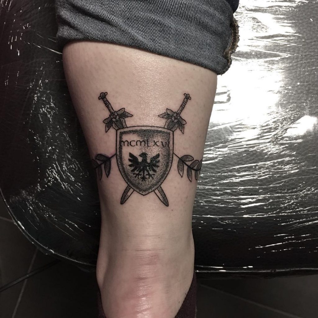 Shield tattoo with a date by déczi anita