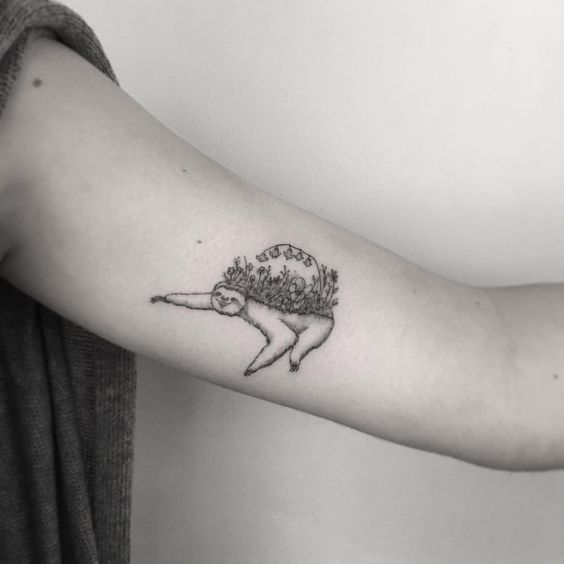 Sloth and flowers tattoo