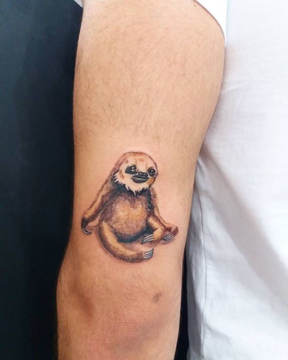 Sloth tattoo on the back of the left arm