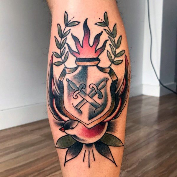 Traditional coat of arms tattoo on the left calf