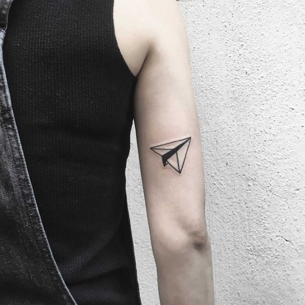 Black and white origami plane tattoo