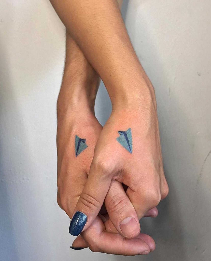 Matching blue paper planes by ericfunkytattoo