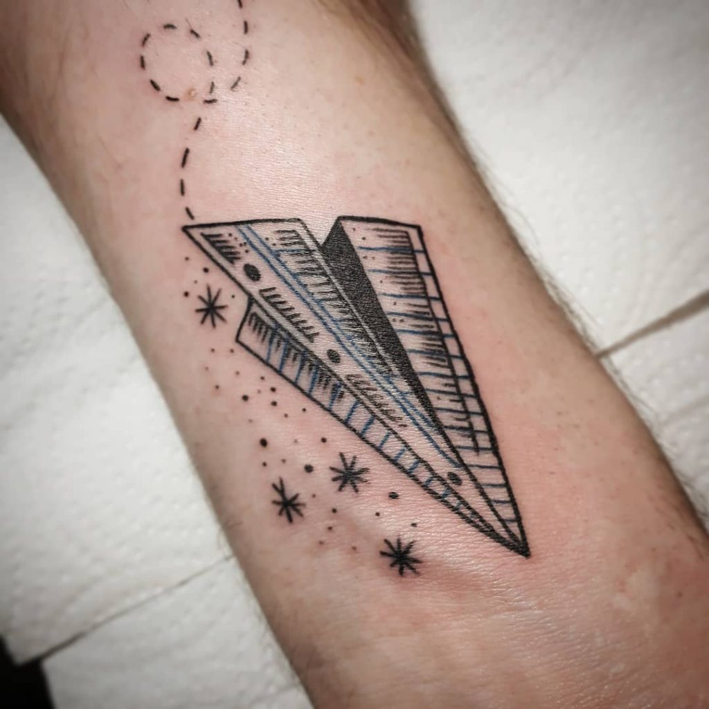 Paper airplane tattoo: learn the meaning and find some beautiful ideas