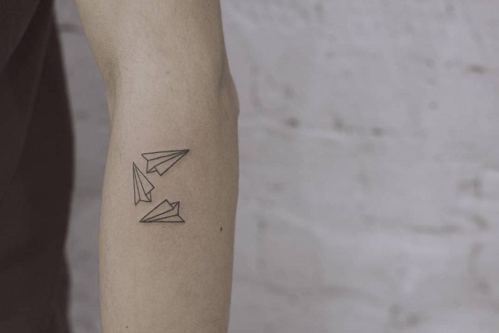 Triple paper airplane tattoo by angryfox13tattooer
