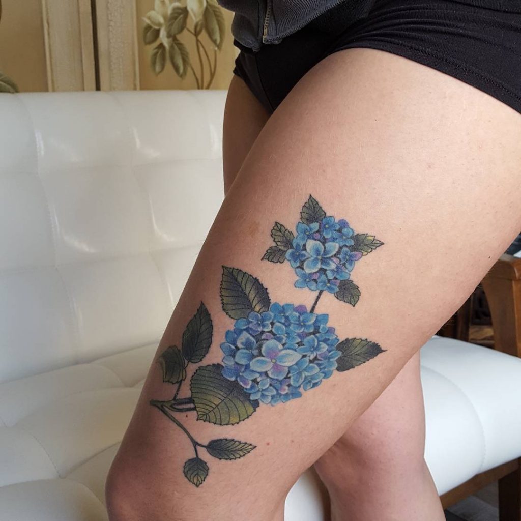 Blue hortensias on the left thigh