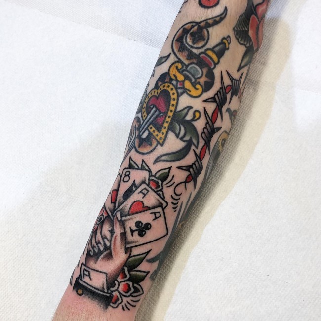 Traditional Style Poker Tattoo On A Forearm