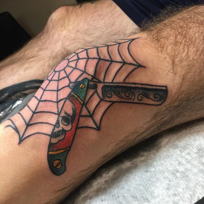 Knee web and straight razor by @alec tattoos