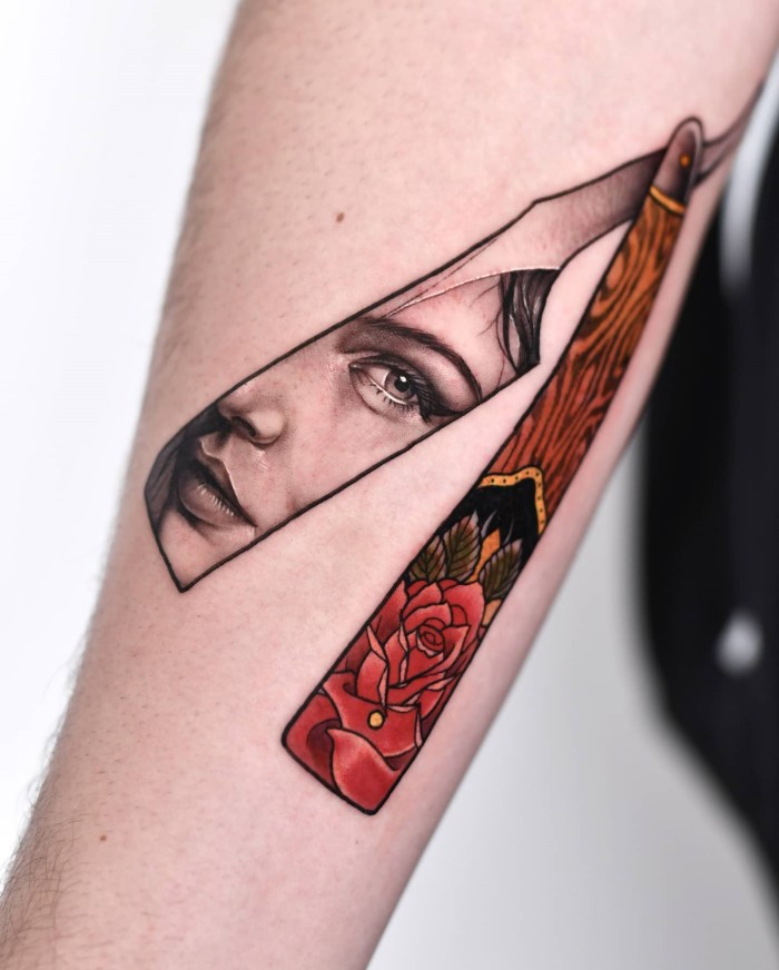 Razor with a girls face reflection tattooed by @vans.tatts