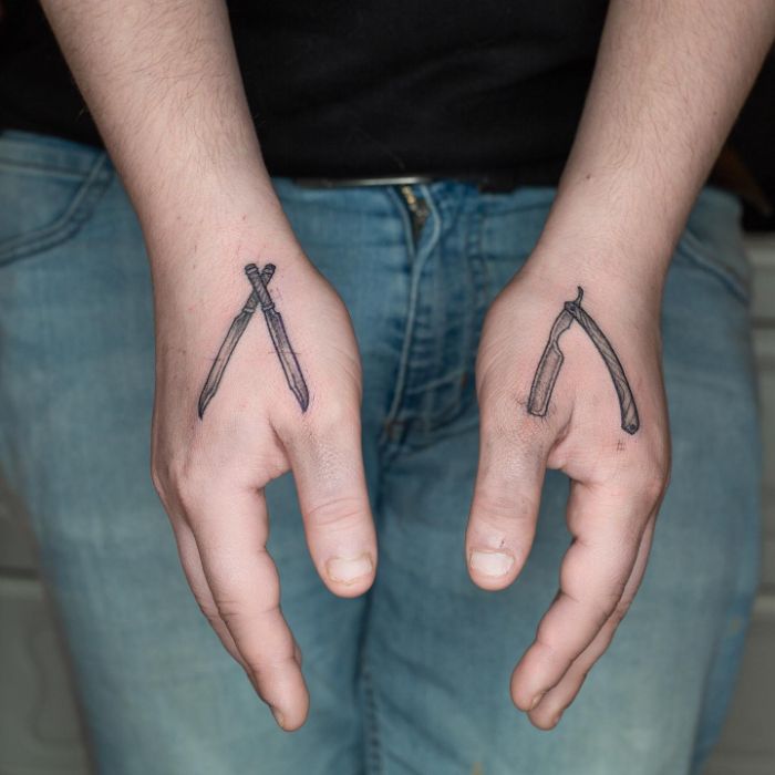 Small straight razor tattooed on the left hand by @guyonfrancois
