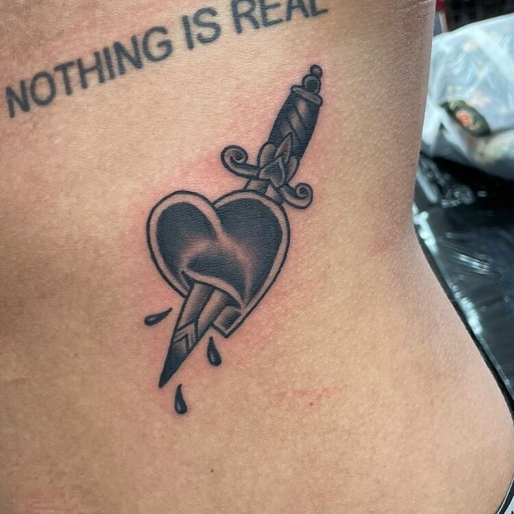 Black Dagger and heart tattoo Piece by @kaynesherwoodtattoo