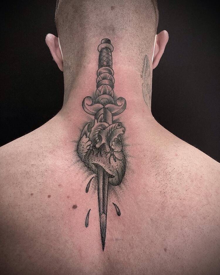 Cool Trad Piece On The Back of the Neck by @trashmantattoos