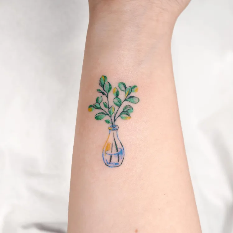 Eucalyptus vase tattoo by @eden tattoo 